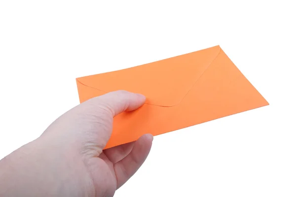 Hand med orange kuvert — Stockfoto