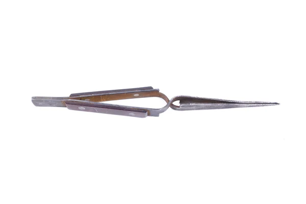 Old metal tweezers on a white background — Stock Photo, Image