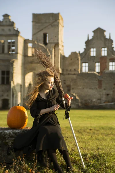 Witch with pale skin hold apple at hand — Stock Photo, Image