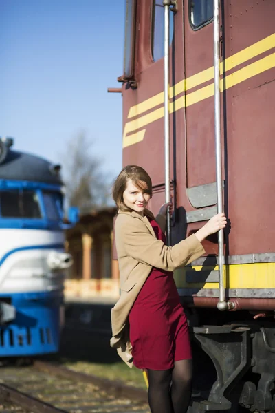 Woman in coat and wagon at day — Stock Photo, Image