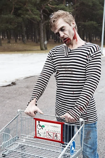 Zombie gone shopping for some horrow movies — Stock Photo, Image