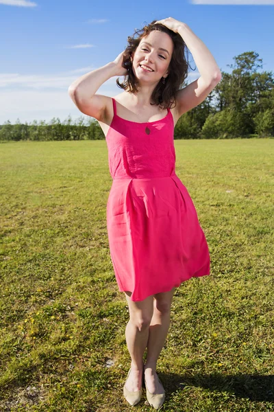 Posing young woman on the juicy background — Stock Photo, Image