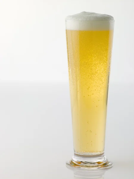 Glass Of Foaming Beer — Stock Photo, Image