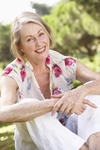 Senior Woman Relaxing In Countryside — Stock Photo, Image
