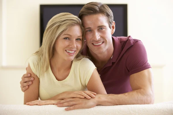 Couple Watching TV At Home Royalty Free Stock Photos
