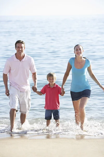 Family Running On Beach Royalty Free Stock Photos