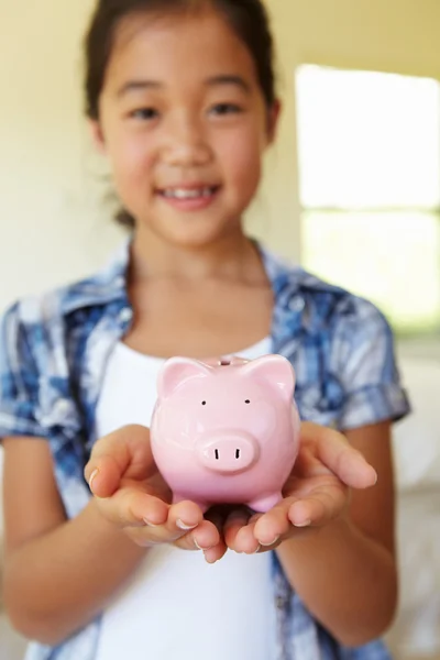 Young girl holding piggybank — Stock Photo, Image