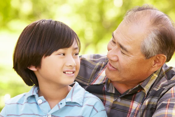 Boy and grandfather spending time in the garden — Stock Photo, Image