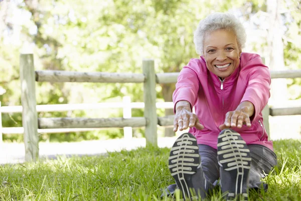 Senior Woman Exercising In Park — Stock Photo, Image