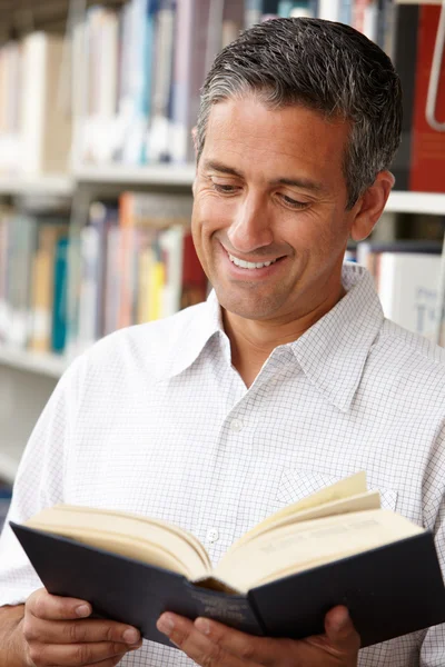 Mature student in library — Stock Photo, Image