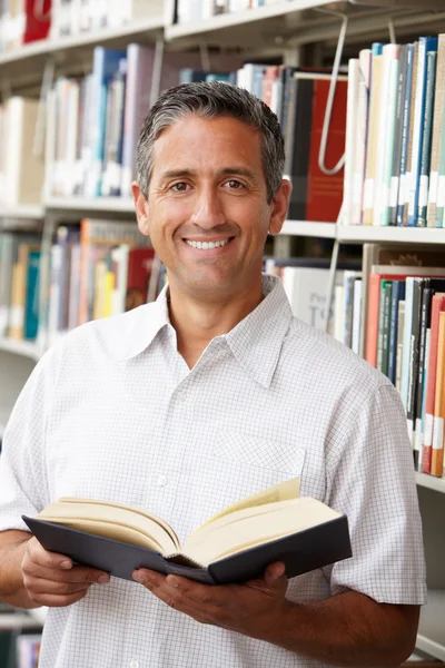 Mature student in library — Stock Photo, Image
