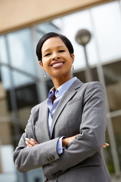 Confident Businesswoman with crossed hands — Stock Photo, Image