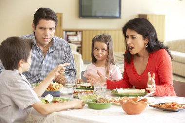 Young Family Enjoying Meal  clipart