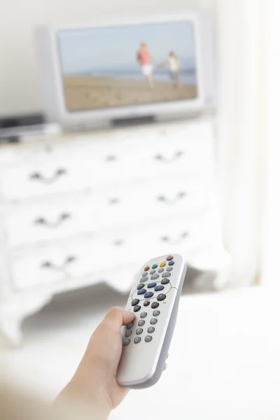 Menina Segurando Televisão Controle Remoto — Fotografia de Stock