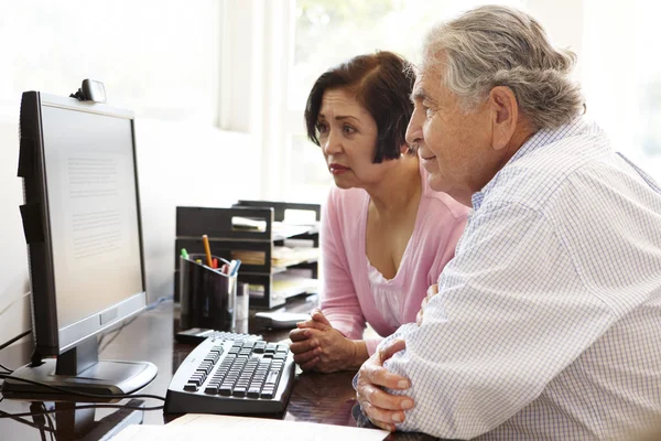 Senior couple working at home — Stock Photo, Image