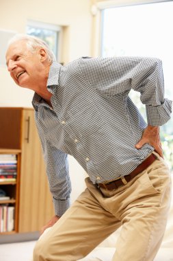 Senior man suffering from backache clipart