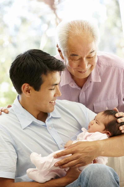 Senior father, adult son and granddaughter — ストック写真