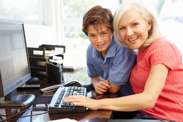 Grandmother and grandson using computer Stock Snímky