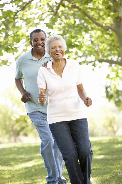 Senior Couple Running In Park — Stock Photo, Image