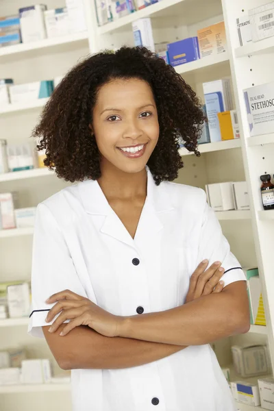 Female nurse standing in pharmacy — Stock Photo, Image