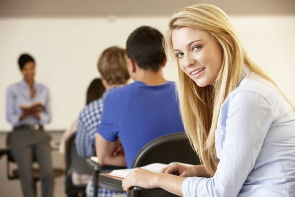 Teenage girl in class smling to camera — Stock Photo, Image