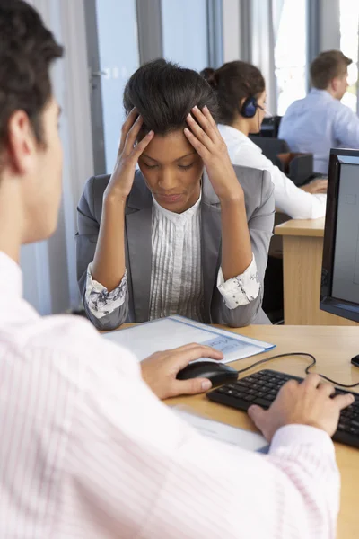 Stressed Employee Working In Busy Office — ストック写真