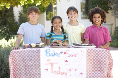 Group Of Children Holding Bake Sale  clipart