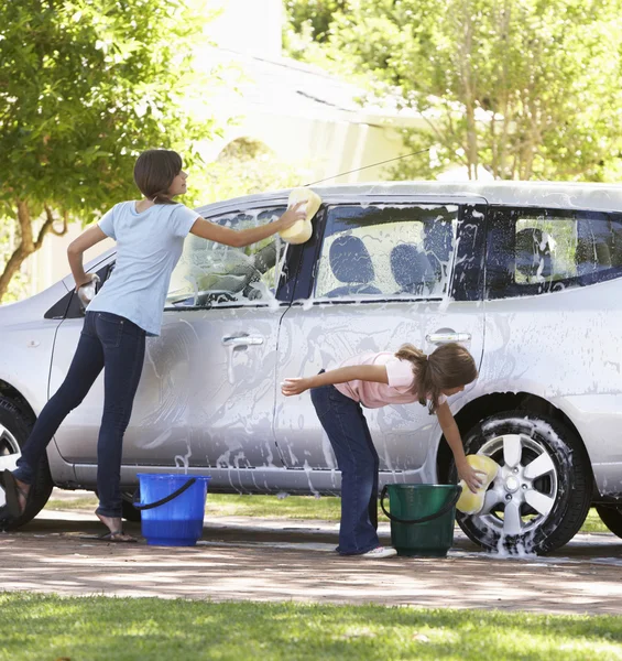 Two Girls Washing Car Together — Stockfoto