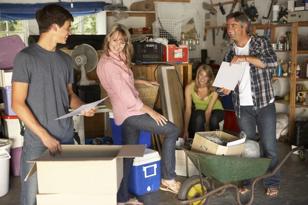 Family Clearing Garage For Yard Sale — Stock Photo, Image