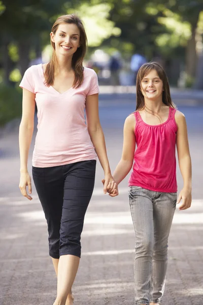 Mother And Daughter Walking Through Park — Stockfoto