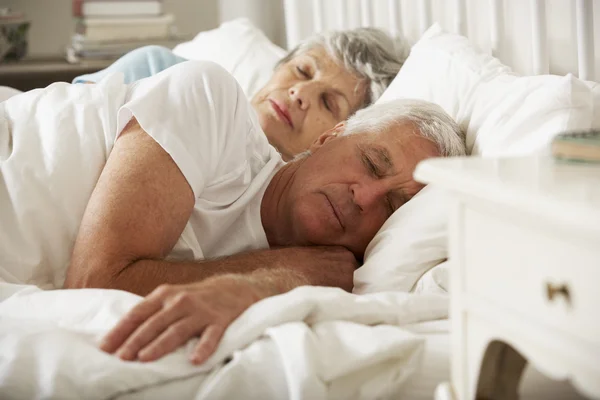 Senior Couple Asleep In Bed Together — Stock Photo, Image