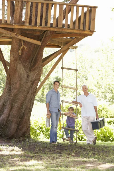 Family Building Tree House Together — ストック写真