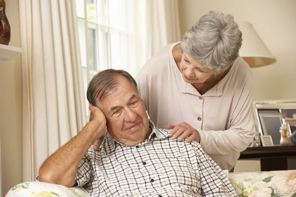 Senior Woman Comforting Unhappy Husband — ストック写真