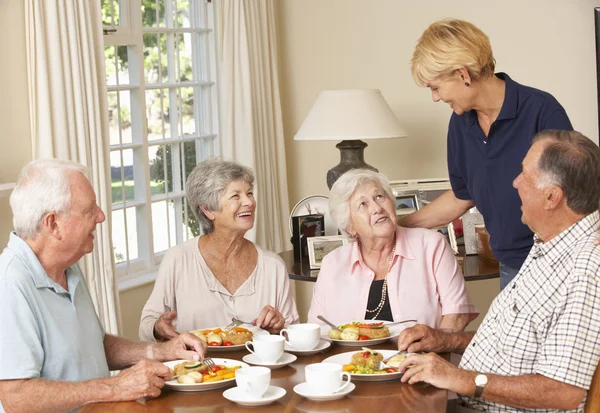 Senior Couples Enjoying Meal Together Stock Image