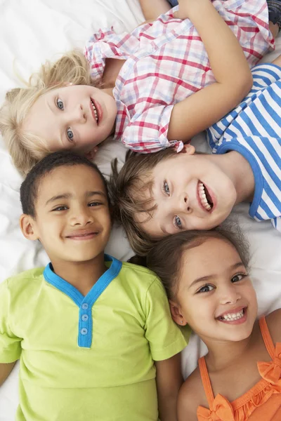 Children Playing On Bed Together Stock Picture