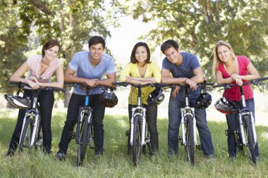 Friends On Cycle Ride In Countryside clipart