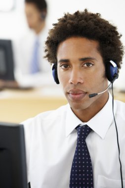 Service Agent Talking To Customer In Call Centre  clipart