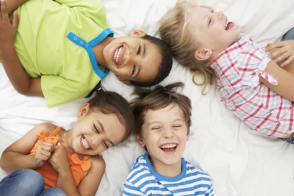 Children Playing On Bed Together — Stock Photo, Image