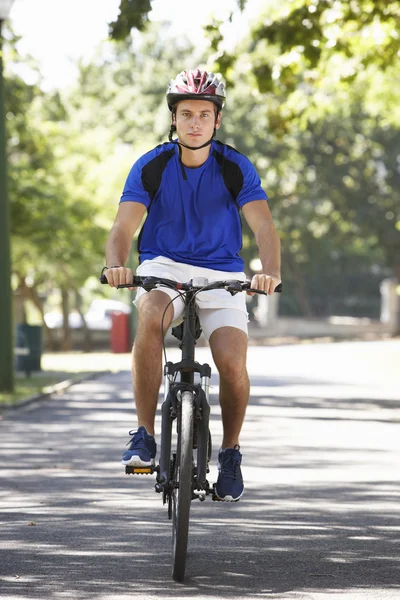 Young Man Cycling Through Park — Stock Photo, Image