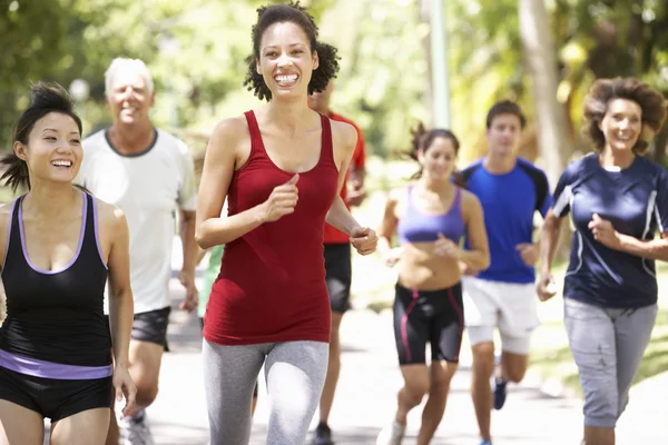 Group Of Runners Jogging Through Park — Stock Photo, Image