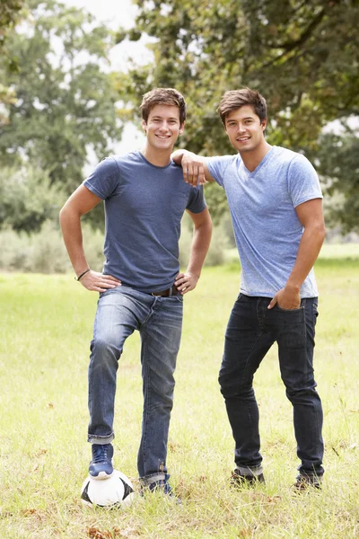 Men Playing With Football In Countryside — Stock Photo, Image