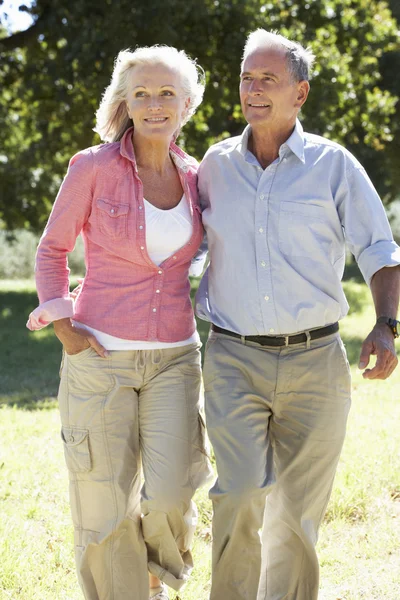 Senior Couple On Walk In Countryside Royalty Free Stock Photos