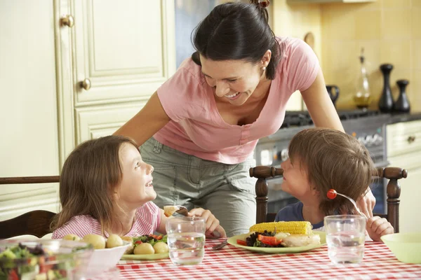 Mother Serving Meal To Children Royalty Free Stock Photos