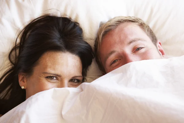 Couple Relaxing In Bed — Stock Photo, Image