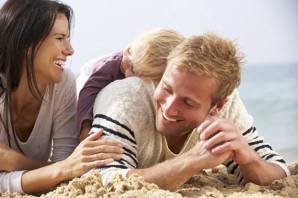 Family Sitting On Beach Together Royalty Free Stock Photos