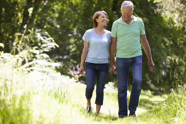 Senior Couple Walking In Countryside — Stock Photo, Image