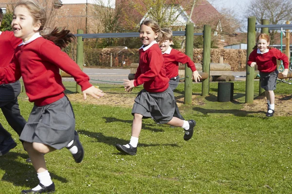 Pupils Running Near Climbing Equipment Stock Image