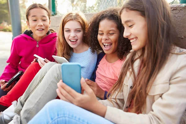 Girls Using Digital Devices In Park — Stock Photo, Image