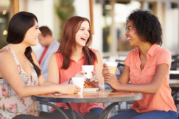 Female Friends Meeting In Cafe Stock Photo