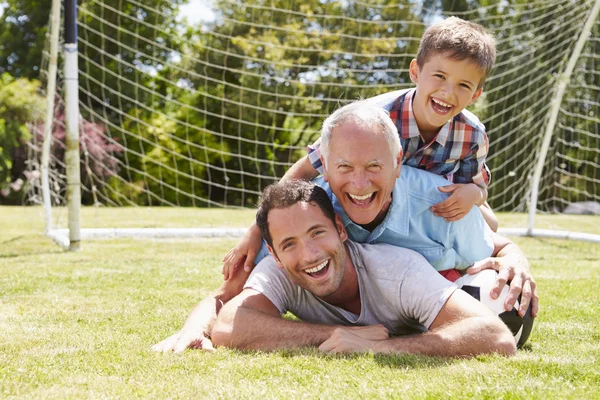 Farfar, sonson och far i trädgården — Stockfoto